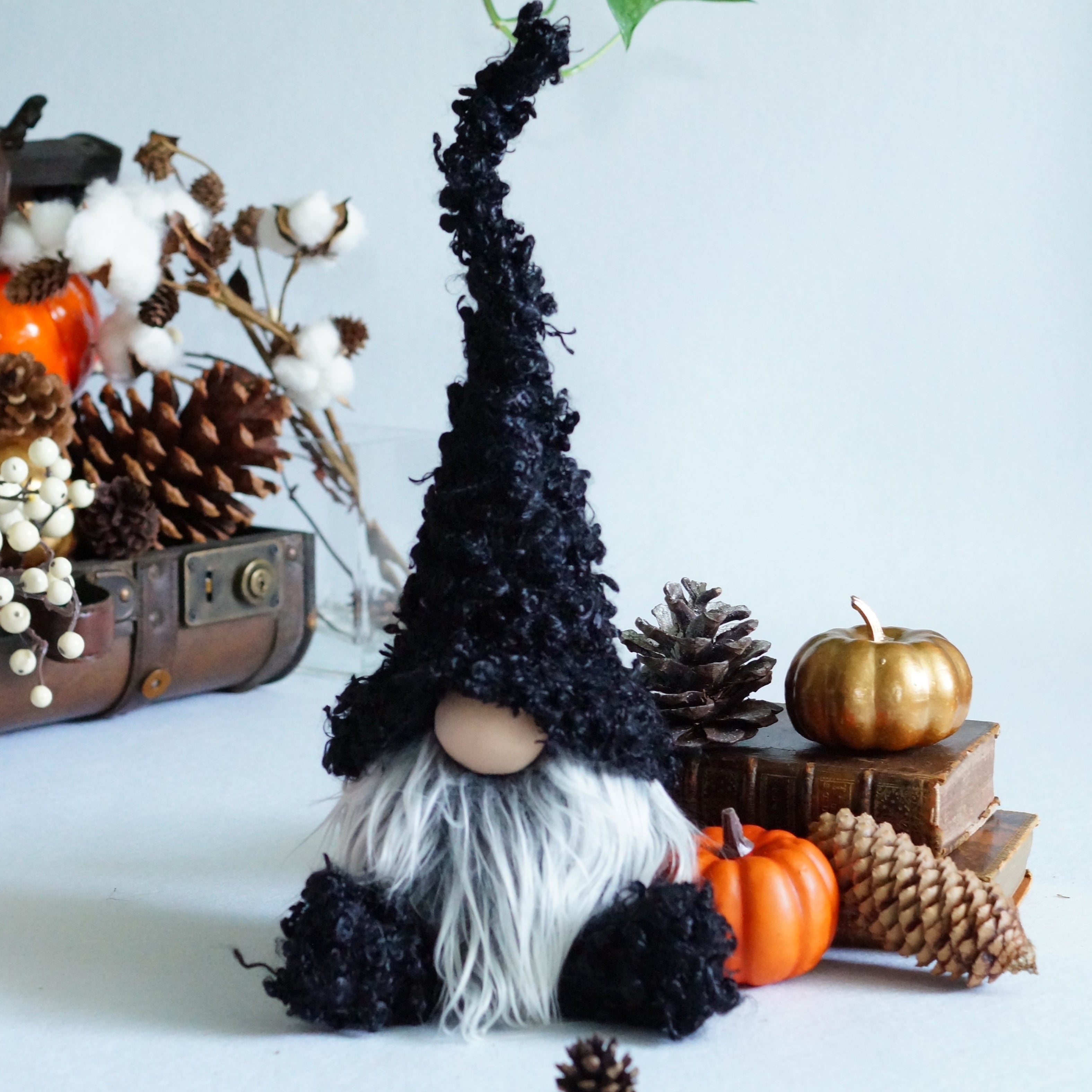 Black gnome with mossy like fabric