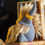 Load image into Gallery viewer, Stuffed animal with Viking helmet sitting on a stack of books
