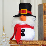 Load image into Gallery viewer, Decorative snowman figure with a black top hat and red scarf on top of books against a neutral background
