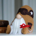 Load image into Gallery viewer, Stuffed gnome with a star and red bow on a shelf
