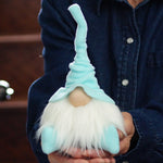 Load image into Gallery viewer, Person holding a small gnome with a blue hat and white beard.
