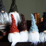 Load image into Gallery viewer, Set of decorative gnomes with various hairstyles and outfits on a surface.
