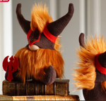 Load image into Gallery viewer, A handmade focus guardian with orange fur and a horned helmet, inspired by Gimli the Viking, sits on antique books holding a small red axe.
