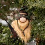 Load image into Gallery viewer, Gnome ornament with hunting theme hanging in a tree
