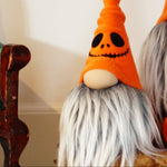 Load image into Gallery viewer, Two Halloween-themed gnomes with orange hats and gray beards on a table with pumpkins.
