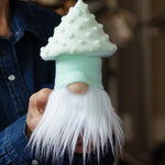 Load image into Gallery viewer, Person holding a small mushroom gnome figurine with a white beard and mint green hat.
