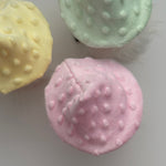 Load image into Gallery viewer, Top view of three textured mushroom hat gnomes in pink, yellow, and green on a white table. 
