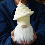 Load image into Gallery viewer, Person holding a small butter yellow mushroom gnome figurine with white beard

