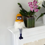 Load image into Gallery viewer, Decorative gnome with a white beard and black hat next to a vase of flowers on a white surface.
