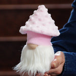 Load image into Gallery viewer, Handmade mushroom gnome featuring a textured pink mushroom hat and fluffy white beard sitting on a white table.
