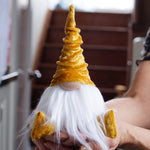 Load image into Gallery viewer, Person holding a small gnome with a yellow hat and white beard in a kitchen setting
