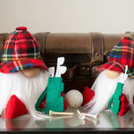 Load image into Gallery viewer, Two decorative gnomes with plaid hats and golf-themed accessories on a reflective surface.
