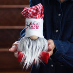 Load image into Gallery viewer, Person holding a chef gnome with a white hat and red checkered with thats amore write across the hat
