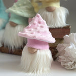 Load image into Gallery viewer, Trio of cottagecore mushroom gnomes with pink, yellow, and green textured hats displayed on a tiered surface.
