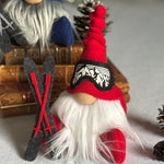 Load image into Gallery viewer, Two decorative ski gnomes with red and blue hats ski goggles and  a set of skis
