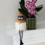 Load image into Gallery viewer, Gnome with best soccer mom ever on a baseball cap sitting on a mantel next to a purple orchid
