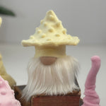 Load image into Gallery viewer, Yellow mushroom hat gnome sitting on a stack of books, perfect for woodland aesthetic decor.

