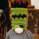 Load image into Gallery viewer, Handcrafted Halloween gnome resembling Frankenstein's monster, with green fleece hat and black fleece hair, black scare stiches across forehead and  wooden screws. Handmade in Canada ideal for cute Halloween home decor
